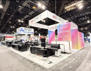 Custom tradeshow booth design, fabrication, and installation for CET by FX Design Group, featuring integrated digital signage and modern architectural elements.